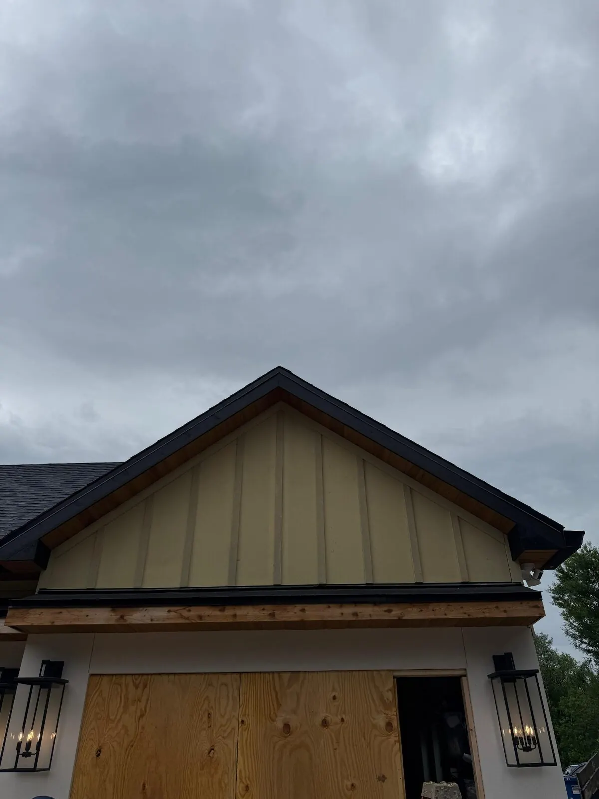 Finished board-and-batten gable above a garage