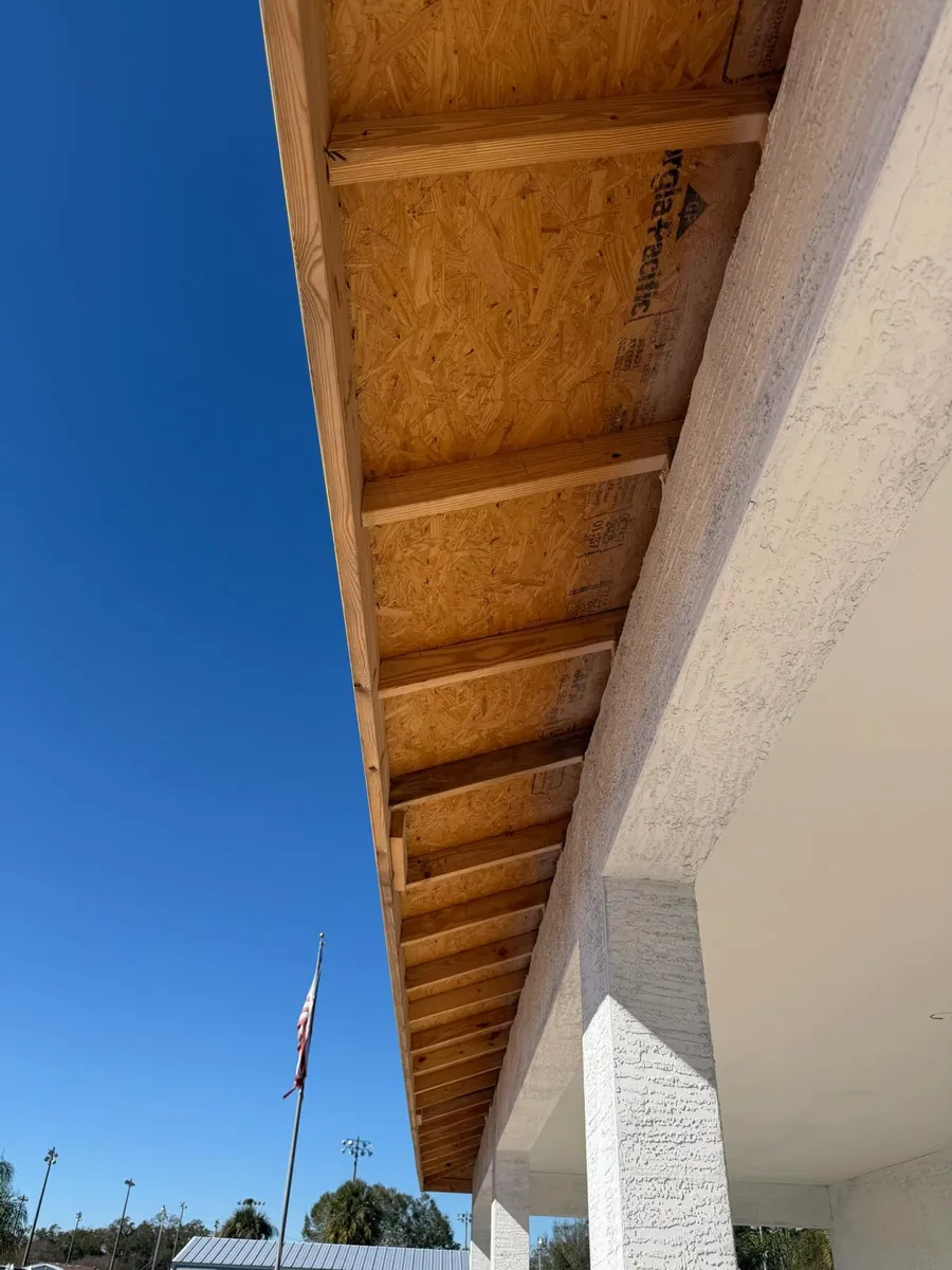 Open roof eave with exposed framing before soffit installation