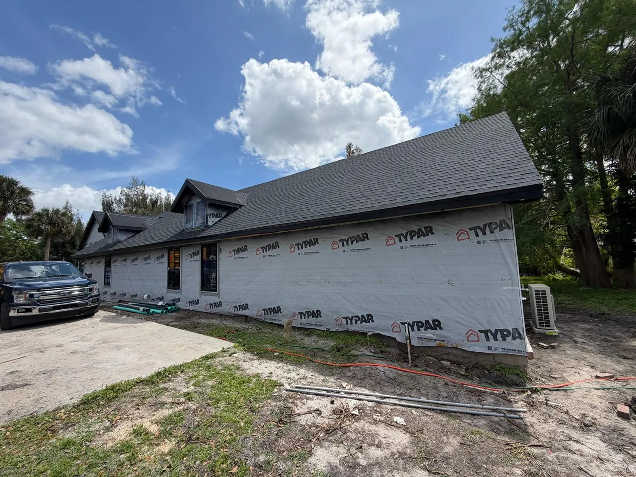 Home with dormers and wrapped walls ready for siding
