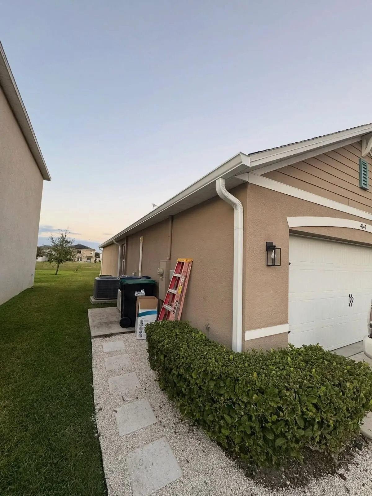 Side elevation with a gutter and downspout